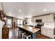 Open concept kitchen featuring an island with barstool seating at 28505 County Road 5, Elizabeth, CO 80107