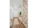 Bright and spacious entryway with modern wood-look flooring and stylish wall decor at 2237 Crosswind St, Fort Lupton, CO 80621
