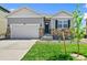 Curb appeal abounds in this charming ranch home featuring a two-car garage and well-manicured lawn at 2237 Crosswind St, Fort Lupton, CO 80621