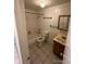 Bathroom with tile floor, combination tub and shower, toilet, sink, and vanity at 8826 E Florida Ave # 204, Denver, CO 80247