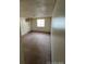Modest bedroom with carpeting, window and baseboard heating at 8826 E Florida Ave # 204, Denver, CO 80247