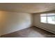 Bedroom with carpeting and baseboard heating and a window at 8826 E Florida Ave # 204, Denver, CO 80247