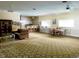 Spacious common room with multiple seating areas and kitchen bar at 8826 E Florida Ave # 204, Denver, CO 80247