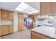 Well-lit kitchen offering stainless steel refrigerator and ample cabinet space at 14050 E Linvale Pl # 601, Aurora, CO 80014