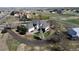 Aerial view of home with expansive yard, mature trees, white fencing, and outbuilding at 29852 E 163Rd Pl, Brighton, CO 80603