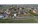 Sprawling property showcasing a home, outbuildings, and white fence within a residential community at 29852 E 163Rd Pl, Brighton, CO 80603