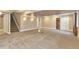 Finished basement features carpeting, drop lighting and a staircase to the main floor at 29852 E 163Rd Pl, Brighton, CO 80603