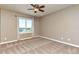 Cozy bedroom with neutral walls, plush carpeting, and a bright window view at 29852 E 163Rd Pl, Brighton, CO 80603