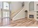 Bright foyer boasting high ceilings, staircase, fireplace and large windows allowing natural light at 29852 E 163Rd Pl, Brighton, CO 80603