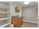 Large walk-in closet with cabinets, countertops, shelving and hanging storage space at 29852 E 163Rd Pl, Brighton, CO 80603