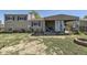 Well-maintained backyard with trampoline, patio featuring hammock and seating, and fire pit at 19502 E Buchanan Pl, Aurora, CO 80011