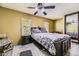 Cozy bedroom featuring neutral walls, plush queen bed, and natural light from two windows at 19502 E Buchanan Pl, Aurora, CO 80011