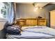 Comfortable bedroom featuring a wood headboard with built-in shelving and a serene atmosphere at 19502 E Buchanan Pl, Aurora, CO 80011