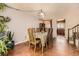 Cozy dining room with hardwood floors and decorative wooden furniture, lit by chandelier at 19502 E Buchanan Pl, Aurora, CO 80011