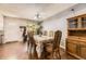 Inviting dining room featuring hardwood floors, classic hutch and view of a window at 19502 E Buchanan Pl, Aurora, CO 80011