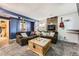 Cozy living room with fireplace, plush sofa, accent lighting, and wood floors at 19502 E Buchanan Pl, Aurora, CO 80011