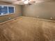Large bedroom with neutral carpet and window at 442 S Kalispell Way # C, Aurora, CO 80017