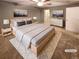Spacious bedroom with light gray carpet and a large bed at 442 S Kalispell Way # C, Aurora, CO 80017