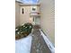 Townhouse exterior featuring a walkway and landscaping at 442 S Kalispell Way # C, Aurora, CO 80017