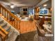 Open living room and kitchen with hardwood floors, fireplace, and staged furniture at 442 S Kalispell Way # C, Aurora, CO 80017