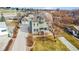 Aerial view showcasing the home's architecture, landscaping, driveway, and surrounding neighborhood at 7996 Bradburn Blvd, Westminster, CO 80030