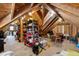 Bright attic space with exposed wooden beams and ample storage, perfect for organizing and decluttering at 7996 Bradburn Blvd, Westminster, CO 80030