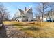 Backyard view of the house with a large grassy area and rock features offering ample outdoor enjoyment at 7996 Bradburn Blvd, Westminster, CO 80030