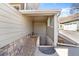 Exterior basement access showcasing the stone foundation and a convenient entrance from the side of the house at 7996 Bradburn Blvd, Westminster, CO 80030