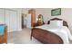 Bedroom with brick accent wall, antique furniture, and bright natural light at 7996 Bradburn Blvd, Westminster, CO 80030