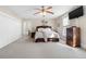 Bedroom with natural light, dark wood furnishings and ceiling fan at 7996 Bradburn Blvd, Westminster, CO 80030