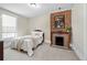 Cozy bedroom with exposed brick fireplace and ample natural light at 7996 Bradburn Blvd, Westminster, CO 80030