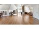 Expansive bonus room showcasing hardwood floors, vaulted ceilings, and natural light at 7996 Bradburn Blvd, Westminster, CO 80030
