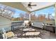 Relaxing covered patio with ceiling fan, bench swing, and outdoor seating, perfect for enjoying the outdoors at 7996 Bradburn Blvd, Westminster, CO 80030