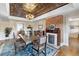 Formal dining room with decorative ceilings, ornate chandelier, and original fireplace at 7996 Bradburn Blvd, Westminster, CO 80030