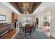 Elegant dining room featuring a decorative ceiling, fireplace, and ample seating at 7996 Bradburn Blvd, Westminster, CO 80030