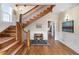 Inviting foyer boasting hardwood floors, a grand staircase, and stylish decor at 7996 Bradburn Blvd, Westminster, CO 80030