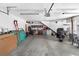 Spacious garage with overhead lighting, workbench, and ample storage space for vehicles and equipment at 7996 Bradburn Blvd, Westminster, CO 80030