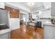 Sunlit kitchen with stainless appliances, marble countertops, and hardwood floors at 7996 Bradburn Blvd, Westminster, CO 80030