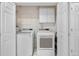 Laundry room with white appliances and closet space at 7996 Bradburn Blvd, Westminster, CO 80030