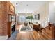 Spacious living room with a decorative fireplace, a plush sofa, and hardwood floors at 7996 Bradburn Blvd, Westminster, CO 80030