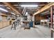 Unfinished basement with exposed beams, lighting, and ample open space, ready for customization and storage at 7996 Bradburn Blvd, Westminster, CO 80030