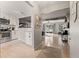 Open concept kitchen with white cabinets, stainless steel appliances, and a breakfast bar at 8358 W 90Th Ave, Broomfield, CO 80021