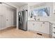 Modern kitchen with white shaker cabinets, stainless steel appliances, and granite countertops at 8358 W 90Th Ave, Broomfield, CO 80021