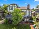Large home showcasing an expansive backyard with a deck and play area at 1175 Oakhurst Dr, Broomfield, CO 80020
