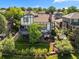 Expansive backyard featuring a multi-level deck, mature trees, and lush landscaping, ideal for outdoor living at 1175 Oakhurst Dr, Broomfield, CO 80020
