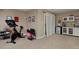 Basement includes fitness equipment, and a kitchenette with a refrigerator, offering convenience and versatility at 1175 Oakhurst Dr, Broomfield, CO 80020