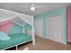 Bright bedroom featuring a whimsical canopy bed and convenient access to storage, offering a comfortable retreat at 1175 Oakhurst Dr, Broomfield, CO 80020