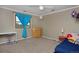 Inviting bedroom with a cozy bed, study area, and ample natural light at 1175 Oakhurst Dr, Broomfield, CO 80020