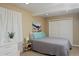 Cozy bedroom features a comfortable bed, closet and soft lighting, creating a relaxing retreat at 1175 Oakhurst Dr, Broomfield, CO 80020