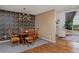 Elegant dining room with wooden table, chairs, and patterned wallpaper at 1175 Oakhurst Dr, Broomfield, CO 80020